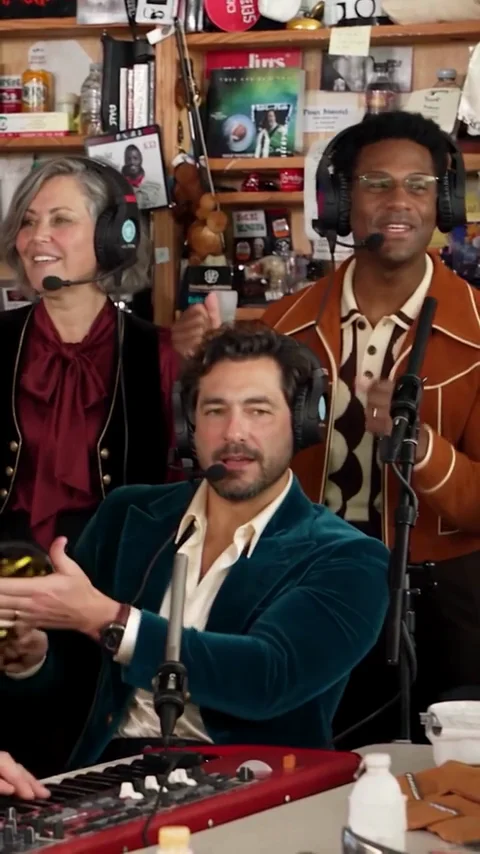 AI band with a teal velvet keyboard player and two retro-dressed backing vocalists